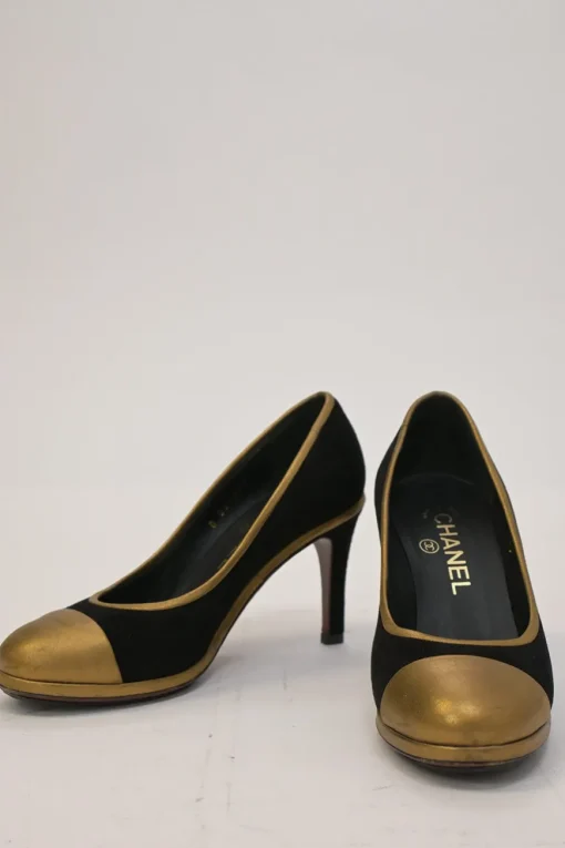 Black and copper suede and leather round-toe platform pumps with contrast cap toe and metallic Coco Mark heel appliqué
