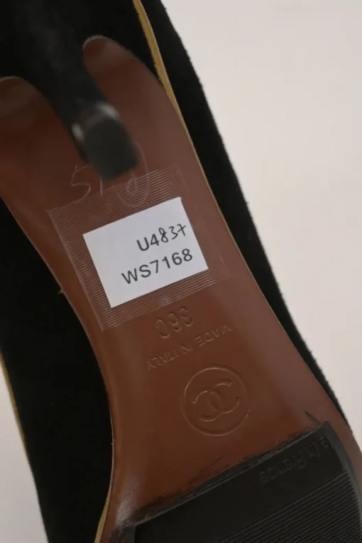 Black and copper suede and leather round-toe platform pumps with contrast cap toe and metallic Coco Mark heel appliqué
