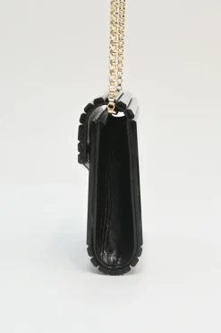 Black and gold acrylic Candy Star clutch with metallic chain strap