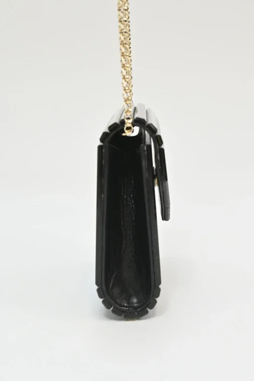 Black and gold acrylic Candy Star clutch with metallic chain strap