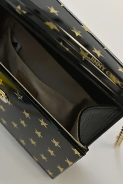 Black and gold acrylic Candy Star clutch with metallic chain strap