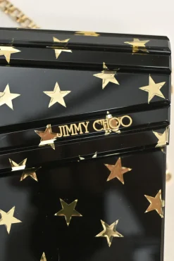 Black and gold acrylic Candy Star clutch with metallic chain strap