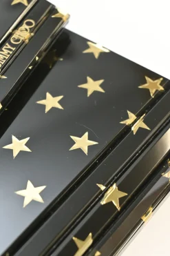 Black and gold acrylic Candy Star clutch with metallic chain strap