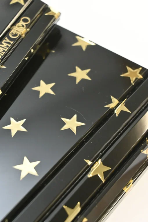 Black and gold acrylic Candy Star clutch with metallic chain strap