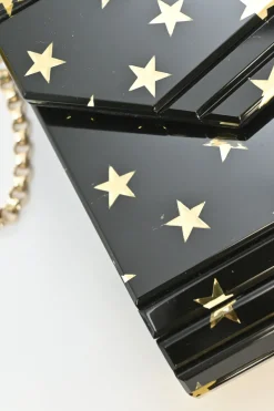 Black and gold acrylic Candy Star clutch with metallic chain strap