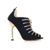 Black and gold peep-toe high-heel bootie exaggerated scalloped cage detail