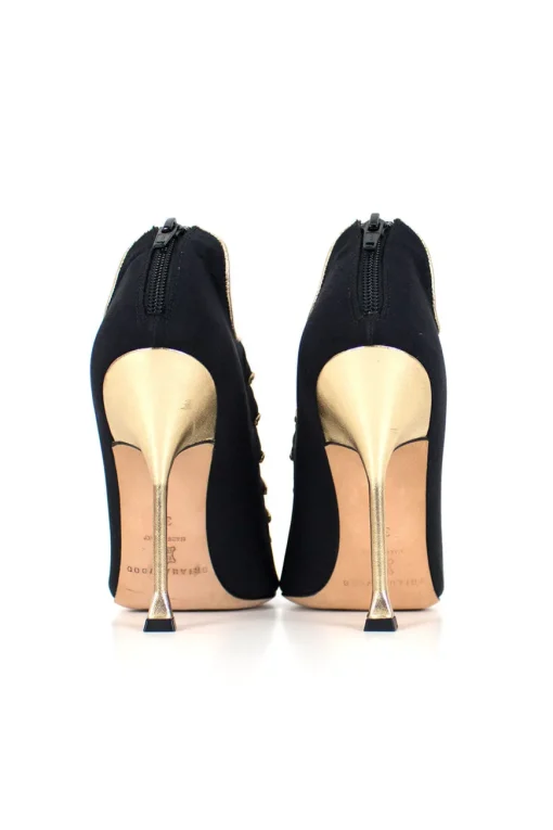Black and gold peep-toe high-heel bootie exaggerated scalloped cage detail