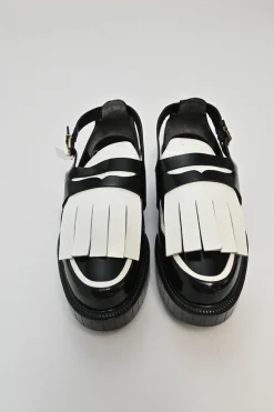 Black and ivory polished calfskin creeper-style cutout penny loafers