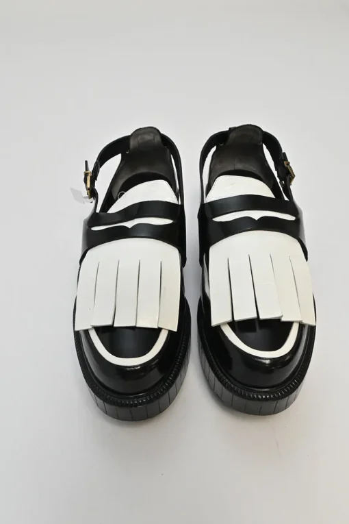 Black and ivory polished calfskin creeper-style cutout penny loafers