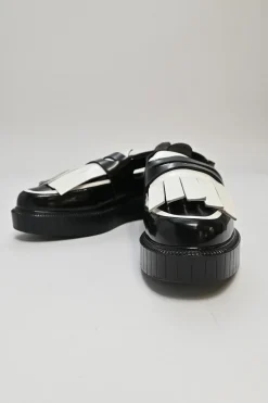Black and ivory polished calfskin creeper-style cutout penny loafers