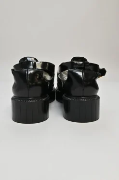 Black and ivory polished calfskin creeper-style cutout penny loafers