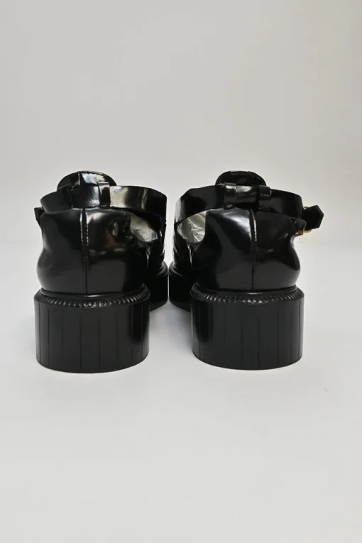 Black and ivory polished calfskin creeper-style cutout penny loafers