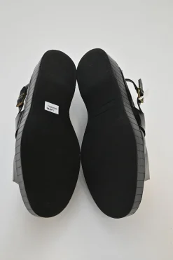 Black and ivory polished calfskin creeper-style cutout penny loafers
