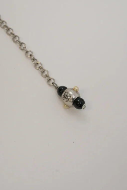 Black and ivory resin and faux pearl beaded double-strand belt with Coco Mark charm buckle