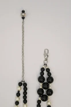 Black and ivory resin and faux pearl beaded double-strand belt with Coco Mark charm buckle