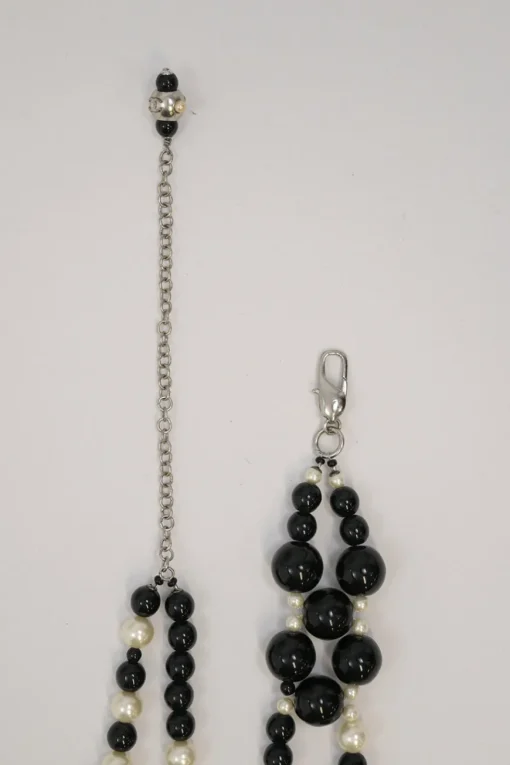 Black and ivory resin and faux pearl beaded double-strand belt with Coco Mark charm buckle