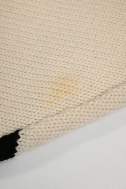 Black and ivory wool fully-fashioned abstract intarsia knit turtleneck pullover sweater with wavy hem