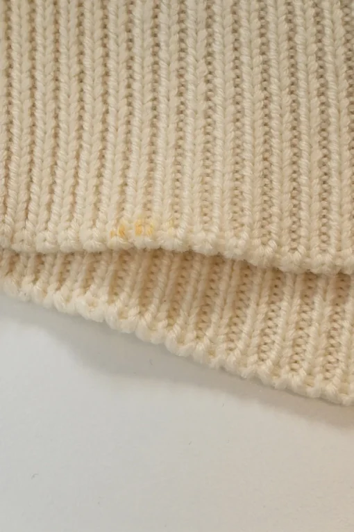 Black and ivory wool fully-fashioned abstract intarsia knit turtleneck pullover sweater with wavy hem