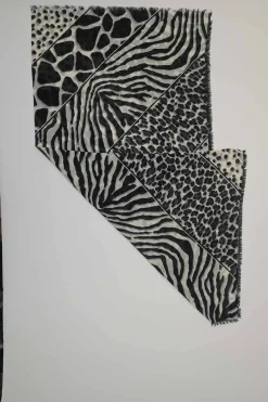 Black and ivory wool-silk blend semi-sheer patchwork animal print fringe scarf