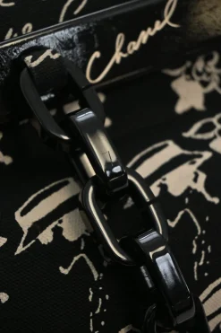 Black and neutral printed canvas and resin chain strap shopper tote featuring house code novelty motif