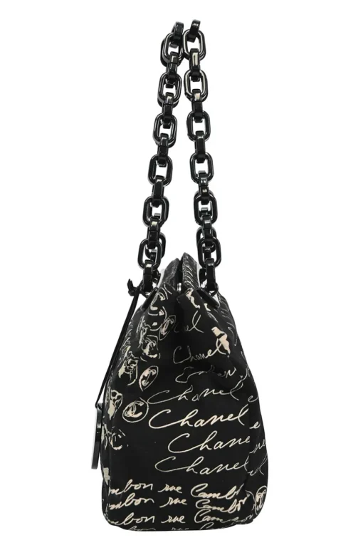 Black and neutral printed canvas and resin chain strap shopper tote featuring house code novelty motif