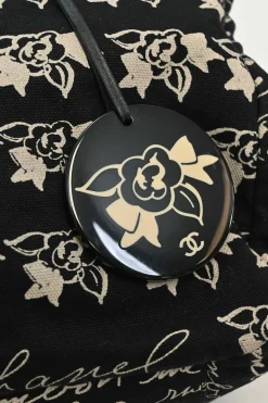 Black and neutral printed canvas and resin chain strap shopper tote featuring house code novelty motif
