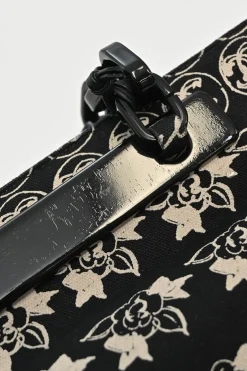 Black and neutral printed canvas and resin chain strap shopper tote featuring house code novelty motif
