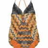 Black and orange rayon-blend paneled chevron knit halter neck one-piece swimsuit