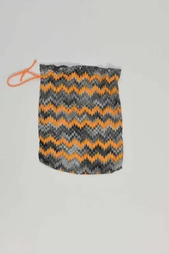 Black and orange rayon-blend paneled chevron knit halter neck one-piece swimsuit