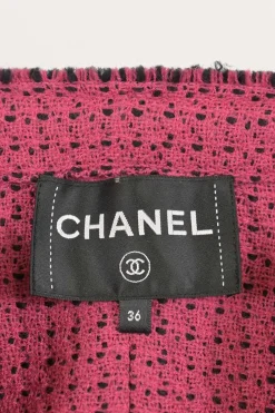 Black and pink wool-blend bouclé tweed two-piece set featuring collarless button-front jacket and mini skirt