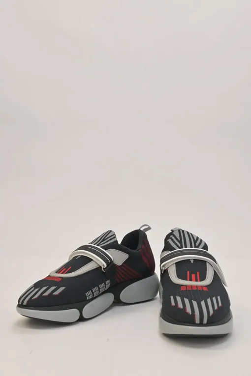 Black and red fully-fashioned warp knit and rubber Cloudbust low-top slip-on velcro sneakers