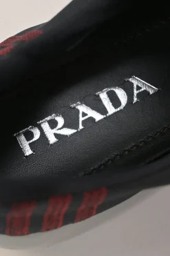 Black and red fully-fashioned warp knit and rubber Cloudbust low-top slip-on velcro sneakers