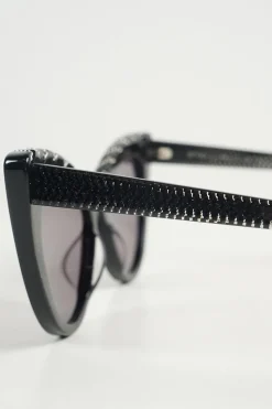 Black bio-acetate cat eye sunglasses with silver chain and shimmer details
