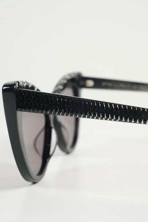 Black bio-acetate cat eye sunglasses with silver chain and shimmer details