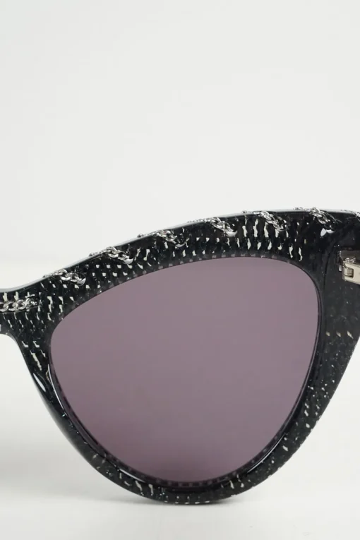 Black bio-acetate cat eye sunglasses with silver chain and shimmer details