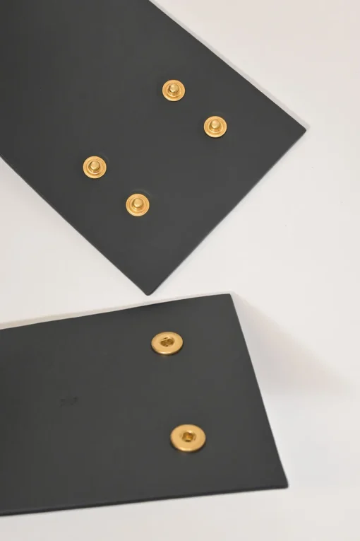 Black box calfskin and gold-finish metal ear belt featuring original Jean Schlumberger 1938 co-created house emblem earring
