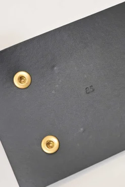 Black box calfskin and gold-finish metal ear belt featuring original Jean Schlumberger 1938 co-created house emblem earring