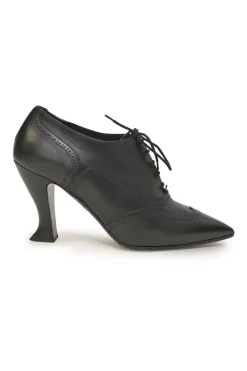 Black brogued leather pointed-toe lace-up Victorian-style heeled booties with metallic Coco Mark heel plaque appliqué