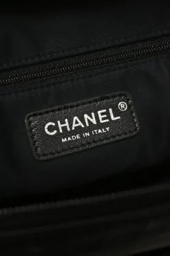 Black calfskin Girl Chanel shoulder bag with Coco Mark shank buttons