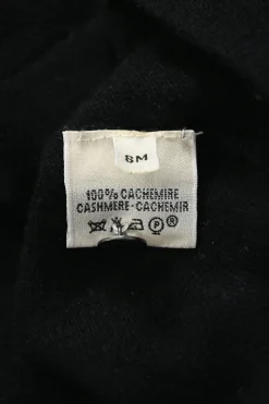 Black cashmere jersey knit two-piece set with crewneck vest and tonal button-front cardigan