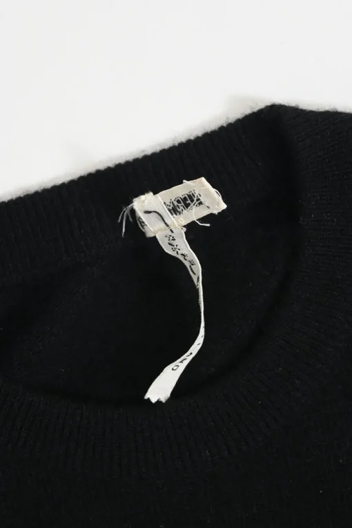 Black cashmere jersey knit two-piece set with crewneck vest and tonal button-front cardigan