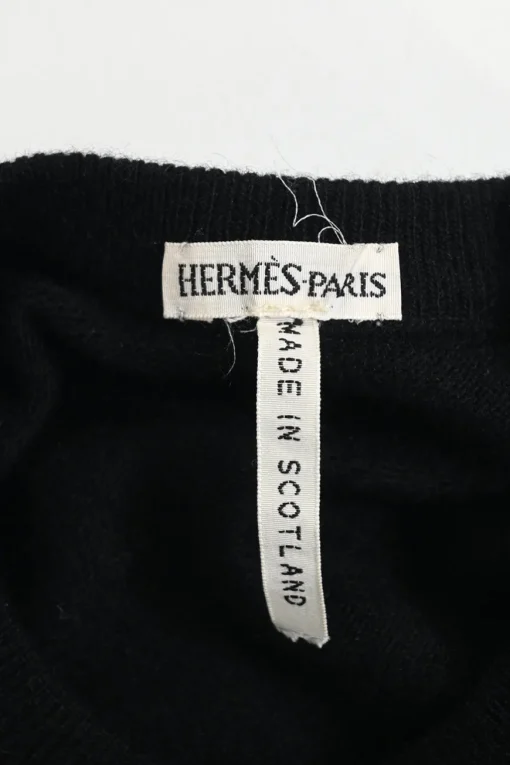 Black cashmere jersey knit two-piece set with crewneck vest and tonal button-front cardigan