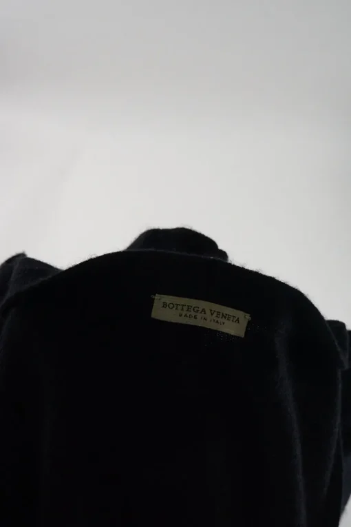 Black cashmere snap-front cardigan with zip pockets