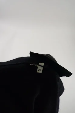 Black cashmere snap-front cardigan with zip pockets