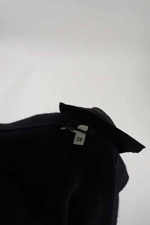Black cashmere snap-front cardigan with zip pockets