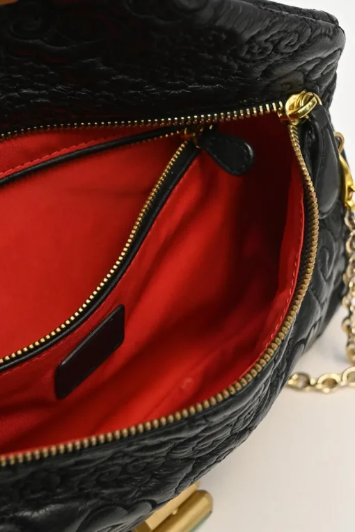 Black cloud-quilted leather crossbody chain flap bag with jade turnlock fastening