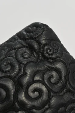 Black cloud-quilted leather crossbody chain flap bag with jade turnlock fastening