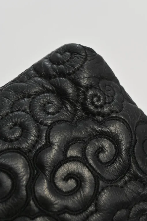 Black cloud-quilted leather crossbody chain flap bag with jade turnlock fastening