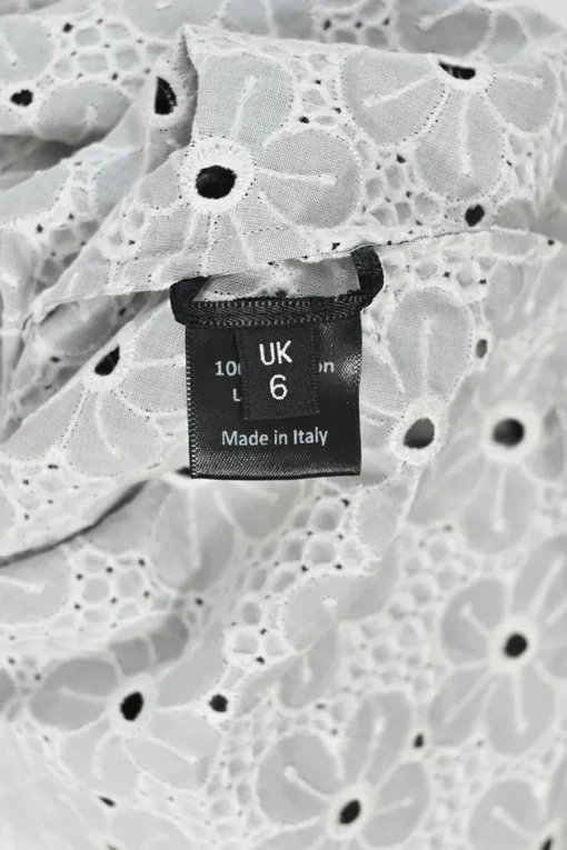 Black cotton floral broderie Anglaise pull-on high-rise A-line slash skirt with frill trim appliqué