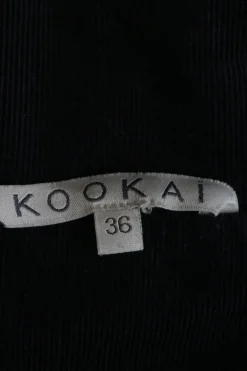 Black cotton twill high collar safari-style chore jacket with cropped sleeves